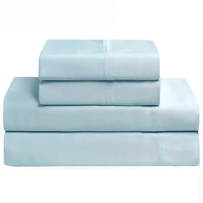 Stack of luxury bamboo bedding sheets in light blue