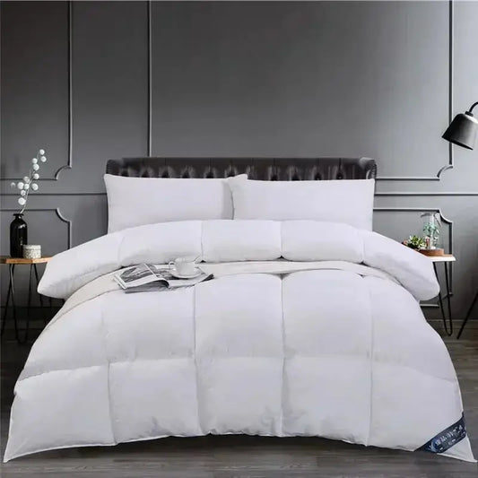 White down comforter on bed in elegant room